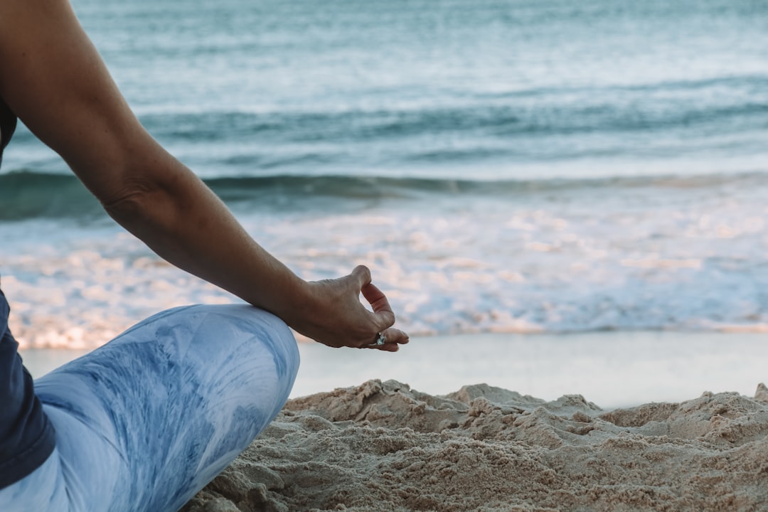 our-services-1 person-in-blue-shorts-sitting-on-beach-shore-during-daytime-n8l1vyaypcw