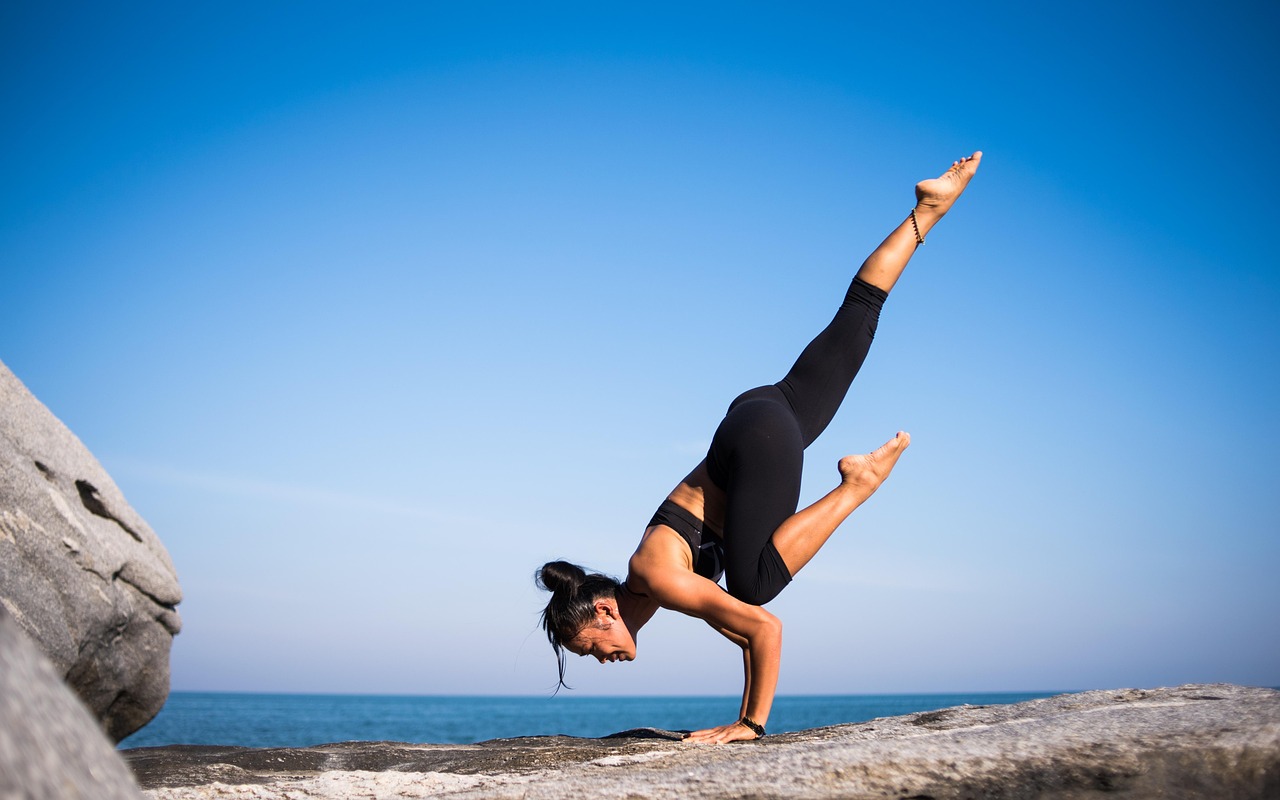 services-03 yoga, strength, woman, balance, balancing, fit, fitness, young woman, fit woman, nature, wellness, pose, yoga pose, posing, strength training, meditation, health, outdoors, beach, international yoga day